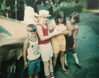 Next to the 1977 Malibu - Guess which one is me.