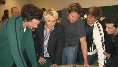 The entire band captivated by Golub's poster in 2005! 