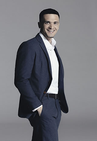 (Photo: Isaac Sterling - Stylist: Tiffani Chynel - Suit: Francisco Van Benthum - Shirt: Reiss)